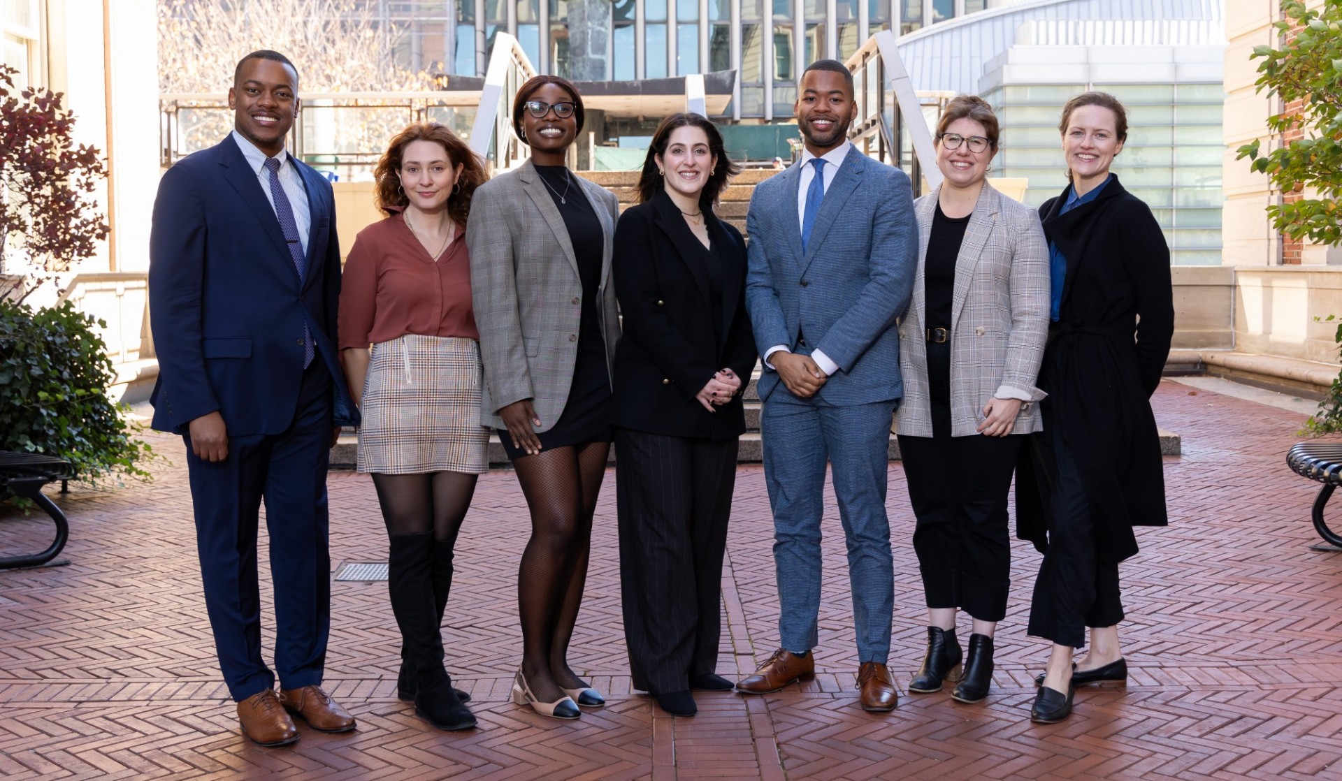 7 people standing together for a group shot. From left to right, Onyx Brunner, Safia Southey, Journey Browne, Liel Sterling, Lyndon DeFoe, Brooke Greenwood, and Jordan Rust. 