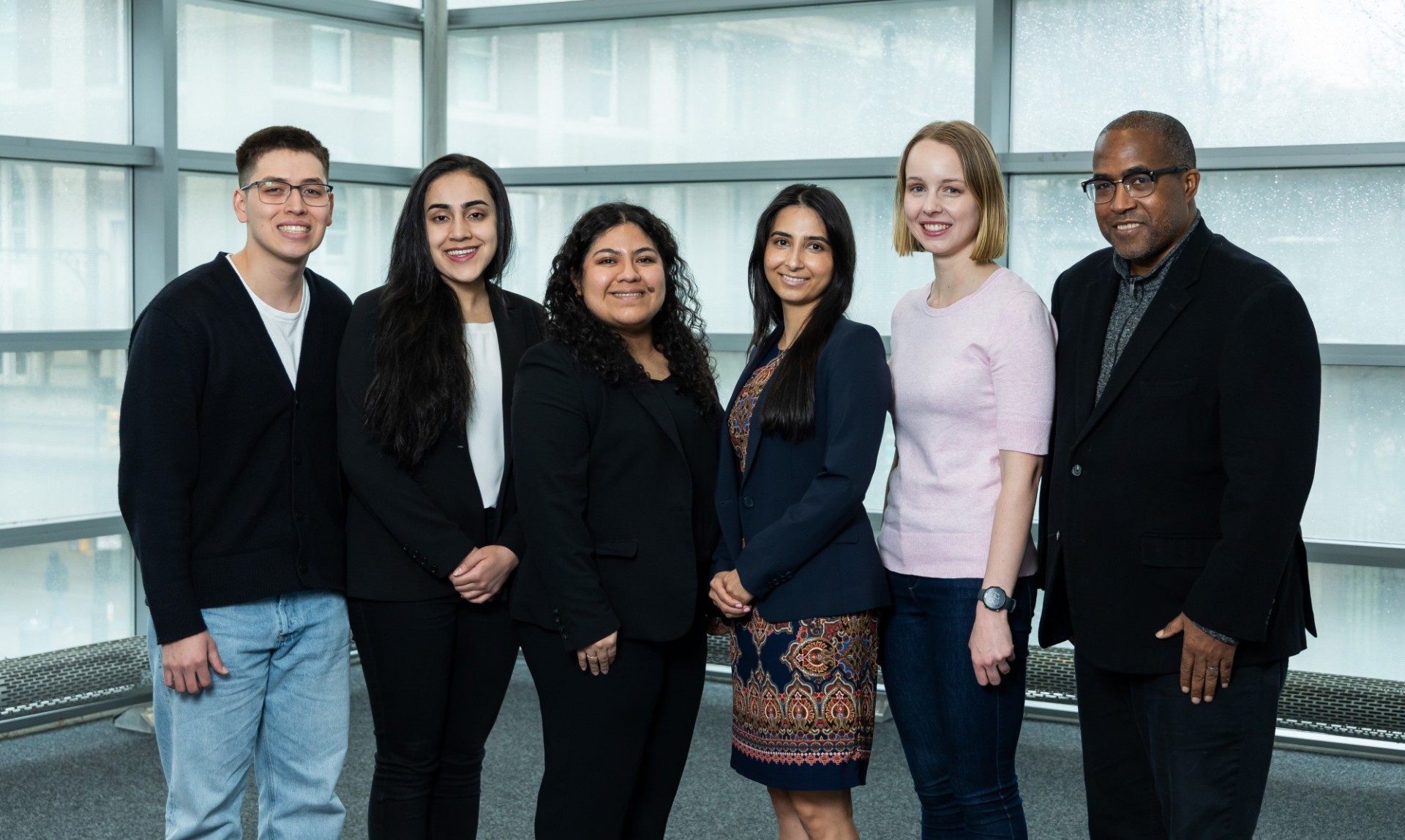 6 people standing together for a group shot. From left to right, Edson Sandoval, Ghalia Aamer, Sandra Ascencio, Rana Hazarat, Jane Spencer, and Richard Gray. 